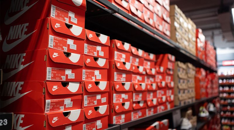 Image of hundreds of Nike shoes stacked up on shelves to support Nike Portland store article