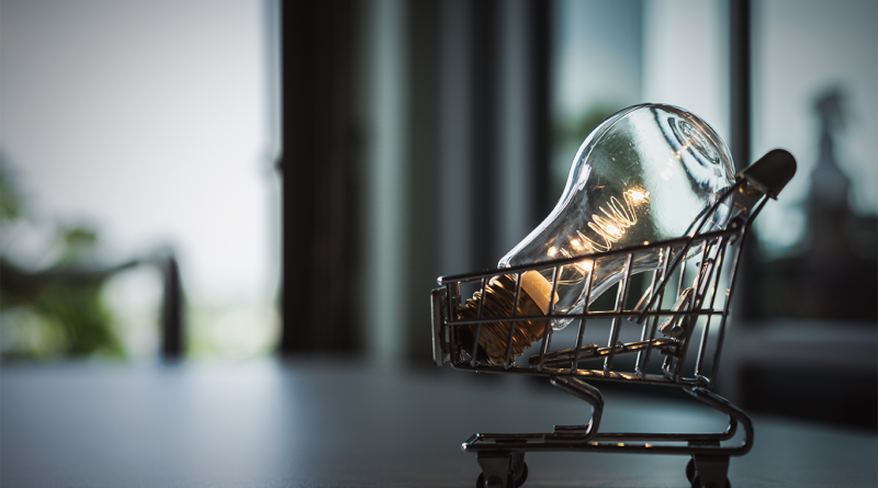 Image of a shopping cart model with a lightbulb in the basket to support retail innovations article