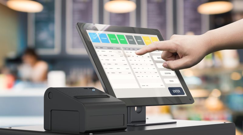 Image of a modern point-of-sale system and secure product display solutions in a retail store.