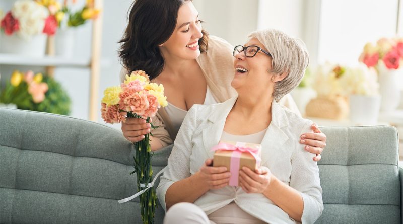 Woman giving her Mom Mother’s Day gifts