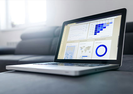 a laptop showing a business or data dashboard