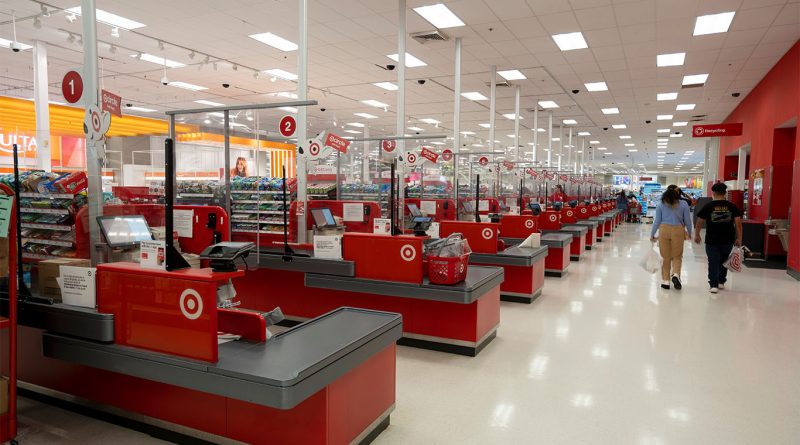 Target’s future unclear as longtime CEO steps aside Silhouette of a departing CEO overlaid with a red downward stock chart inside an empty Target store