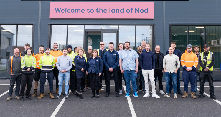 the team from MattressNextDay standing in front of their facility
