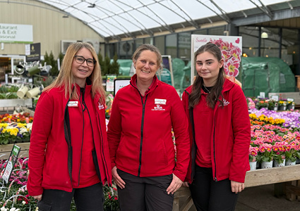  staff members wearing red fleece jackets from British Garden Centres